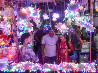 People buy decorative lights ahead of the Diwali festival celebration in Kolkata, India, on October 22, 2024. (