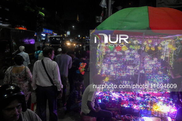 People buy decorative lights ahead of the Diwali festival celebration in Kolkata, India, on October 22, 2024. 