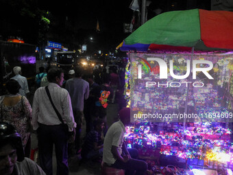 People buy decorative lights ahead of the Diwali festival celebration in Kolkata, India, on October 22, 2024. (