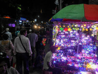 People buy decorative lights ahead of the Diwali festival celebration in Kolkata, India, on October 22, 2024. (