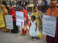 Protesters from the Domestic Workers' National Forum form a human chain at the Shaheed Minar in Dhaka, Bangladesh, on October 22, 2024, dema...