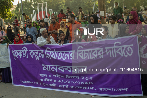 Protesters from the Domestic Workers' National Forum form a human chain at the Shaheed Minar in Dhaka, Bangladesh, on October 22, 2024, dema...