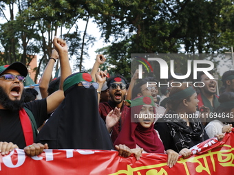 Anti-Discrimination students participate in a protest demanding President Mohammed Shahabuddin step down over his comment about the resignat...