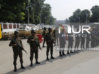 Bangladesh army personnel stand guard in front of Bangabhaban in Dhaka, Bangladesh, on October 22, 2024. (