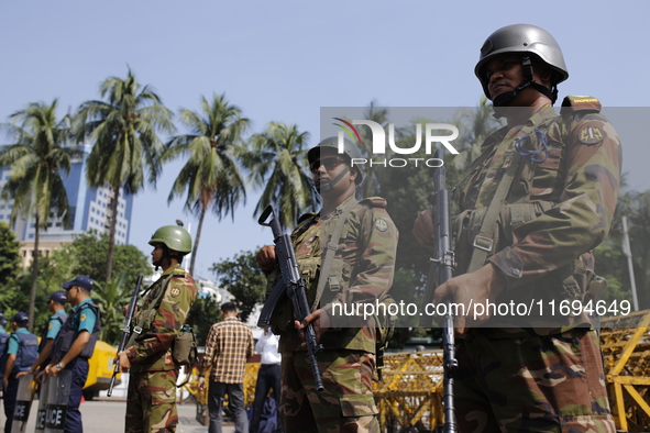 Bangladesh army personnel stand guard in front of Bangabhaban in Dhaka, Bangladesh, on October 22, 2024. 