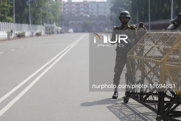 Bangladesh army personnel stand guard in front of Bangabhaban in Dhaka, Bangladesh, on October 22, 2024. 