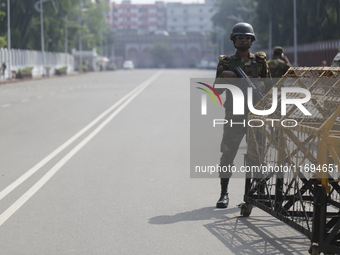 Bangladesh army personnel stand guard in front of Bangabhaban in Dhaka, Bangladesh, on October 22, 2024. (