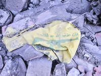 Civilians, paramedics, and Civil Defense Search and Rescue teams conduct search and rescue operations among the rubble of collapsed building...