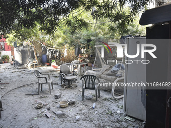 Civilians, paramedics, and Civil Defense Search and Rescue teams conduct search and rescue operations among the rubble of collapsed building...