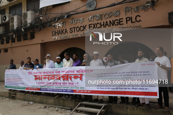 Capital market investors participate in a protest against the fall in stock prices over the past weeks in Dhaka, Bangladesh, on October 22,...