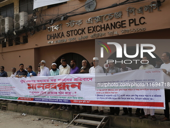 Capital market investors participate in a protest against the fall in stock prices over the past weeks in Dhaka, Bangladesh, on October 22,...