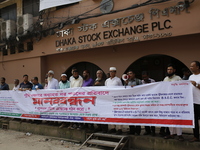 Capital market investors participate in a protest against the fall in stock prices over the past weeks in Dhaka, Bangladesh, on October 22,...