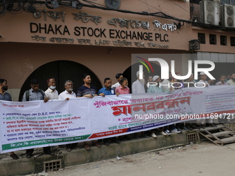 Capital market investors participate in a protest against the fall in stock prices over the past weeks in Dhaka, Bangladesh, on October 22,...