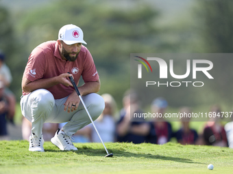 Jon Rahm of Spain studies his shot on the 18th green during day four of the Estrella Damm N.A. Andalucia Masters 2024 at Real Club de Golf S...