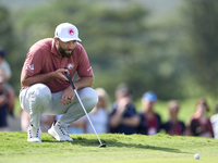 Jon Rahm of Spain studies his shot on the 18th green during day four of the Estrella Damm N.A. Andalucia Masters 2024 at Real Club de Golf S...