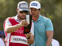 Johannes Veerman of the USA talks with his caddie on the 5th hole during day four of the Estrella Damm N.A. Andalucia Masters 2024 at Real C...