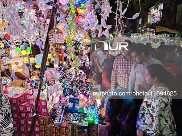 People buy decorative items ahead of the Diwali festival at Chandi Chowk Bazar in Kolkata, India, on October 22, 2024. 