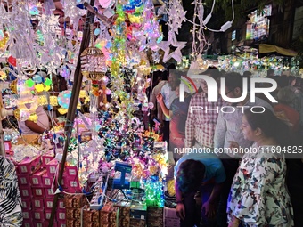 People buy decorative items ahead of the Diwali festival at Chandi Chowk Bazar in Kolkata, India, on October 22, 2024. (