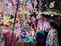 People buy decorative items ahead of the Diwali festival at Chandi Chowk Bazar in Kolkata, India, on October 22, 2024. (