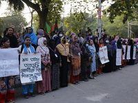 Women take part in a protest against the torture of a domestic worker as they demand justice for assaults on women in Dhaka, Bangladesh, on...