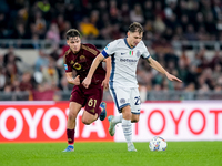 Nicolo' Barella of FC Internazionale and Niccolo' Pisilli of AS Roma compete for the ball during the Serie A Enilive match between AS Roma a...