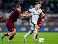 Nicolo' Barella of FC Internazionale and Niccolo' Pisilli of AS Roma compete for the ball during the Serie A Enilive match between AS Roma a...