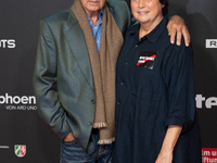 Udo Kier, a German actor, and Martina Richter, the director of the Cologne Film Festival, are seen on the red carpet during the photocall of...