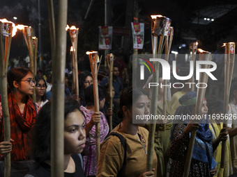 Students and activists take part in a torch procession protest against recent child rape, demanding justice and punishment in all rape cases...