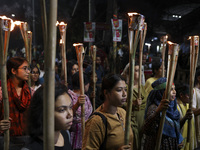 Students and activists take part in a torch procession protest against recent child rape, demanding justice and punishment in all rape cases...