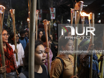 Students and activists take part in a torch procession protest against recent child rape, demanding justice and punishment in all rape cases...