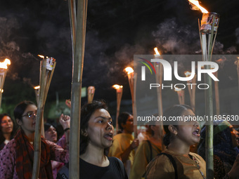 Students and activists take part in a torch procession protest against recent child rape, demanding justice and punishment in all rape cases...