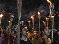 Students and activists take part in a torch procession protest against recent child rape, demanding justice and punishment in all rape cases...