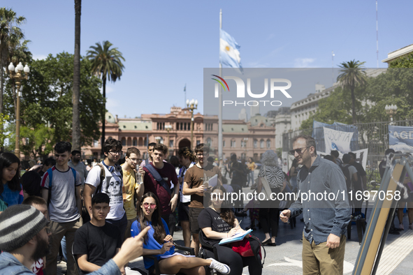 Students take a class outside the Casa Rosada presidential palace during a protest against a bill vetoed by Argentina's President Javier Mil...