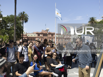 Students take a class outside the Casa Rosada presidential palace during a protest against a bill vetoed by Argentina's President Javier Mil...