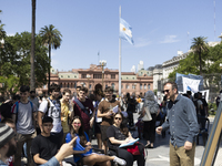 Students take a class outside the Casa Rosada presidential palace during a protest against a bill vetoed by Argentina's President Javier Mil...