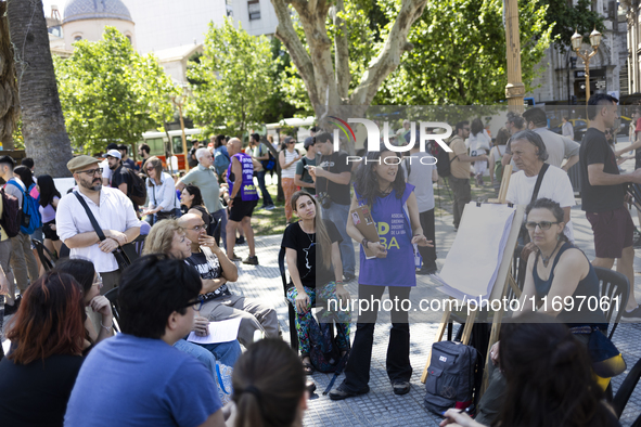 Students take a class outside the Casa Rosada presidential palace during a protest against a bill vetoed by Argentina's President Javier Mil...