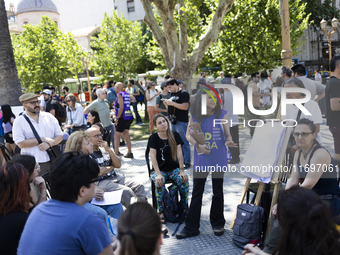 Students take a class outside the Casa Rosada presidential palace during a protest against a bill vetoed by Argentina's President Javier Mil...