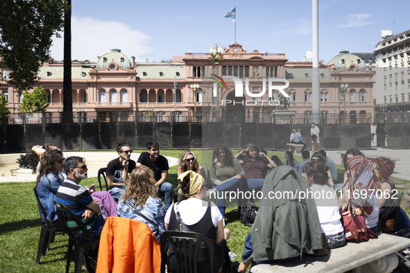 Students take a class outside the Casa Rosada presidential palace during a protest against a bill vetoed by Argentina's President Javier Mil...