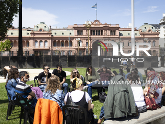 Students take a class outside the Casa Rosada presidential palace during a protest against a bill vetoed by Argentina's President Javier Mil...