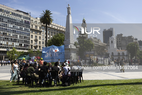 Students take a class outside the Casa Rosada presidential palace during a protest against a bill vetoed by Argentina's President Javier Mil...