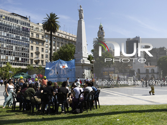 Students take a class outside the Casa Rosada presidential palace during a protest against a bill vetoed by Argentina's President Javier Mil...