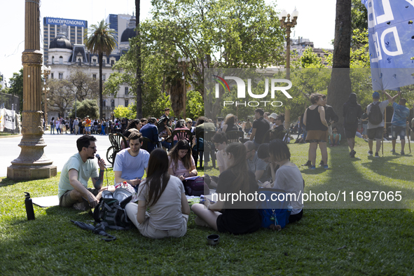 Students take a class outside the Casa Rosada presidential palace during a protest against a bill vetoed by Argentina's President Javier Mil...