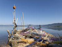 Huge quantities of tubular nets used for mussel farming and buoys employed in the fishing industry invade the sea and the coast around the l...