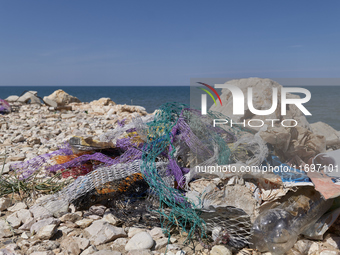 Huge quantities of tubular nets used for mussel farming and buoys employed in the fishing industry invade the sea and the coast around the l...