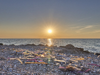 Huge quantities of tubular nets used for mussel farming and buoys employed in the fishing industry invade the sea and the coast around the l...