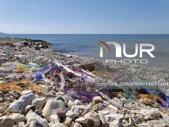 Huge quantities of tubular nets used for mussel farming and buoys employed in the fishing industry invade the sea and the coast around the l...