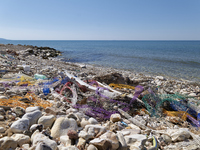 Huge quantities of tubular nets used for mussel farming and buoys employed in the fishing industry invade the sea and the coast around the l...