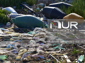 Huge quantities of tubular nets used for mussel farming and buoys employed in the fishing industry invade the sea and the coast around the l...