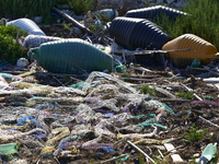 Huge quantities of tubular nets used for mussel farming and buoys employed in the fishing industry invade the sea and the coast around the l...