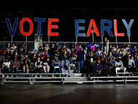 Attendees wait for former President Barack Obama to speak at a presidential campaign rally for Kamala Harris at The Huntington Place in Detr...